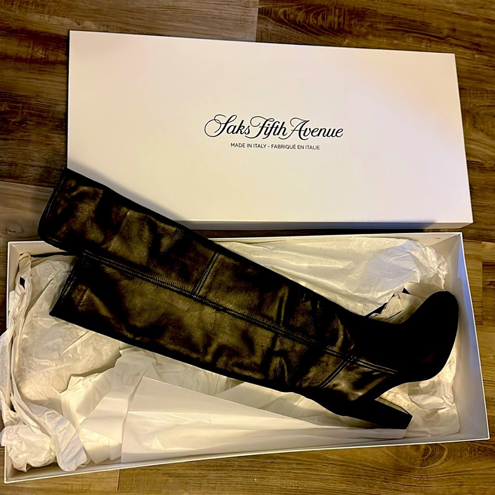 Black leather above the knee boots. Brand new. Never worn. From Saks.